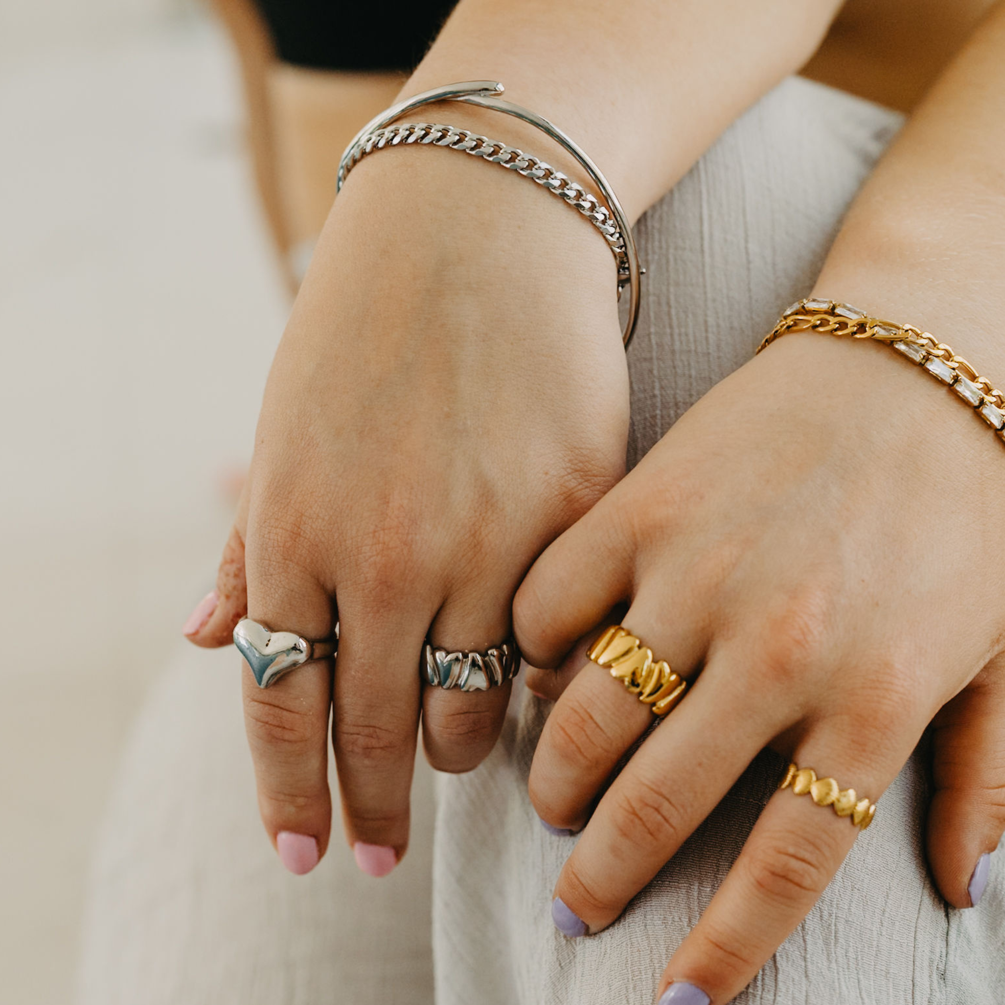 model wearing Sunseeker Cuban link bracelet layered silver waterproof jewelry