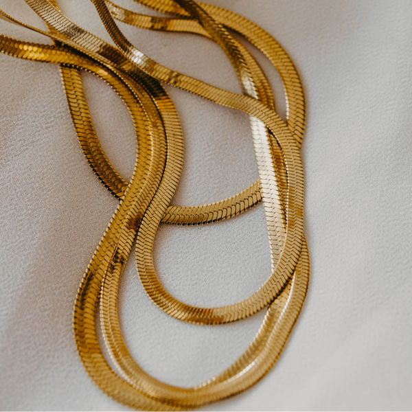 Eclipse herringbone necklace in 18K gold PVD with smooth reflective finish waterproof jewelry
