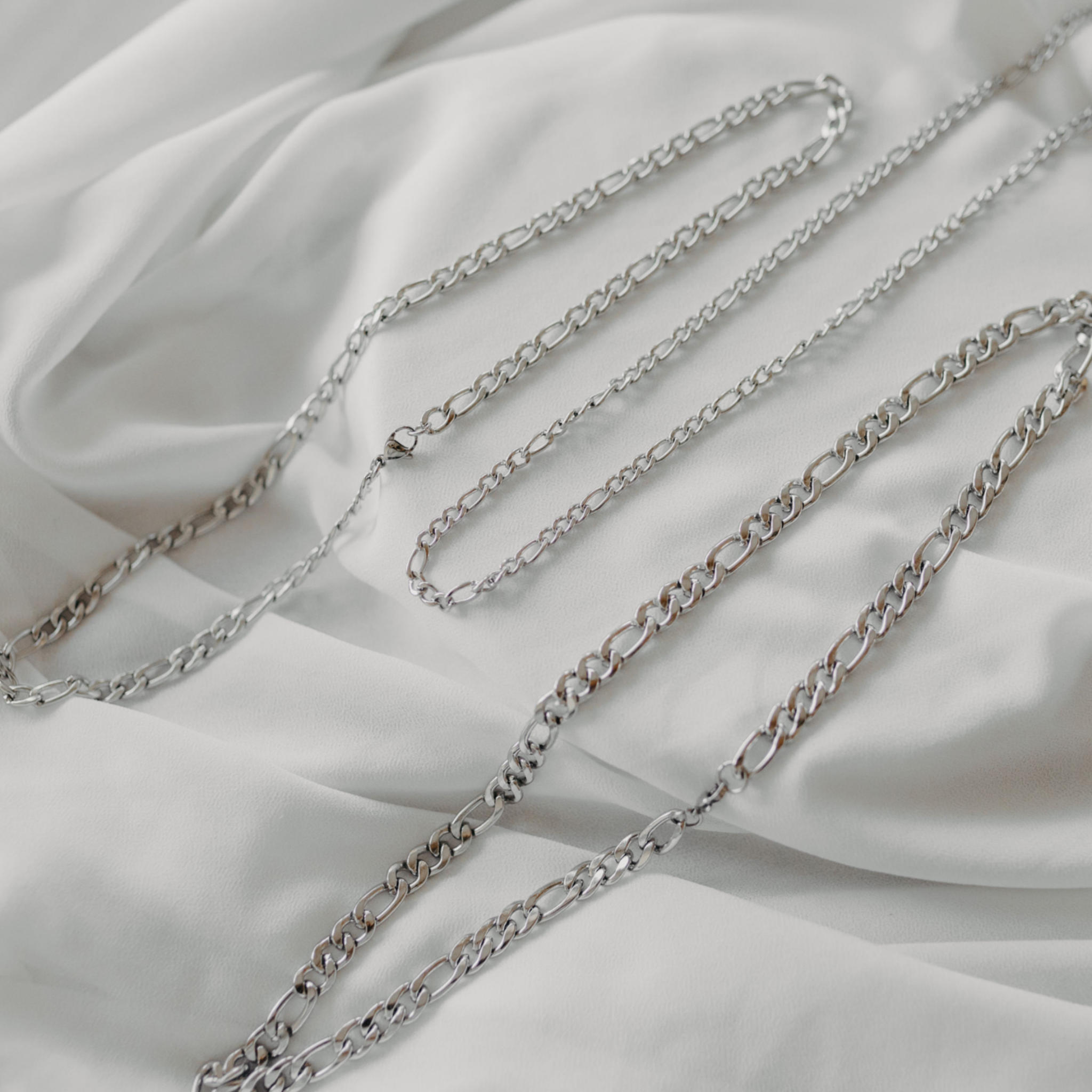 Forge figaro chain necklaces in silver stainless steel showing 4mm 6mm and 8mm widths waterproof jewelry