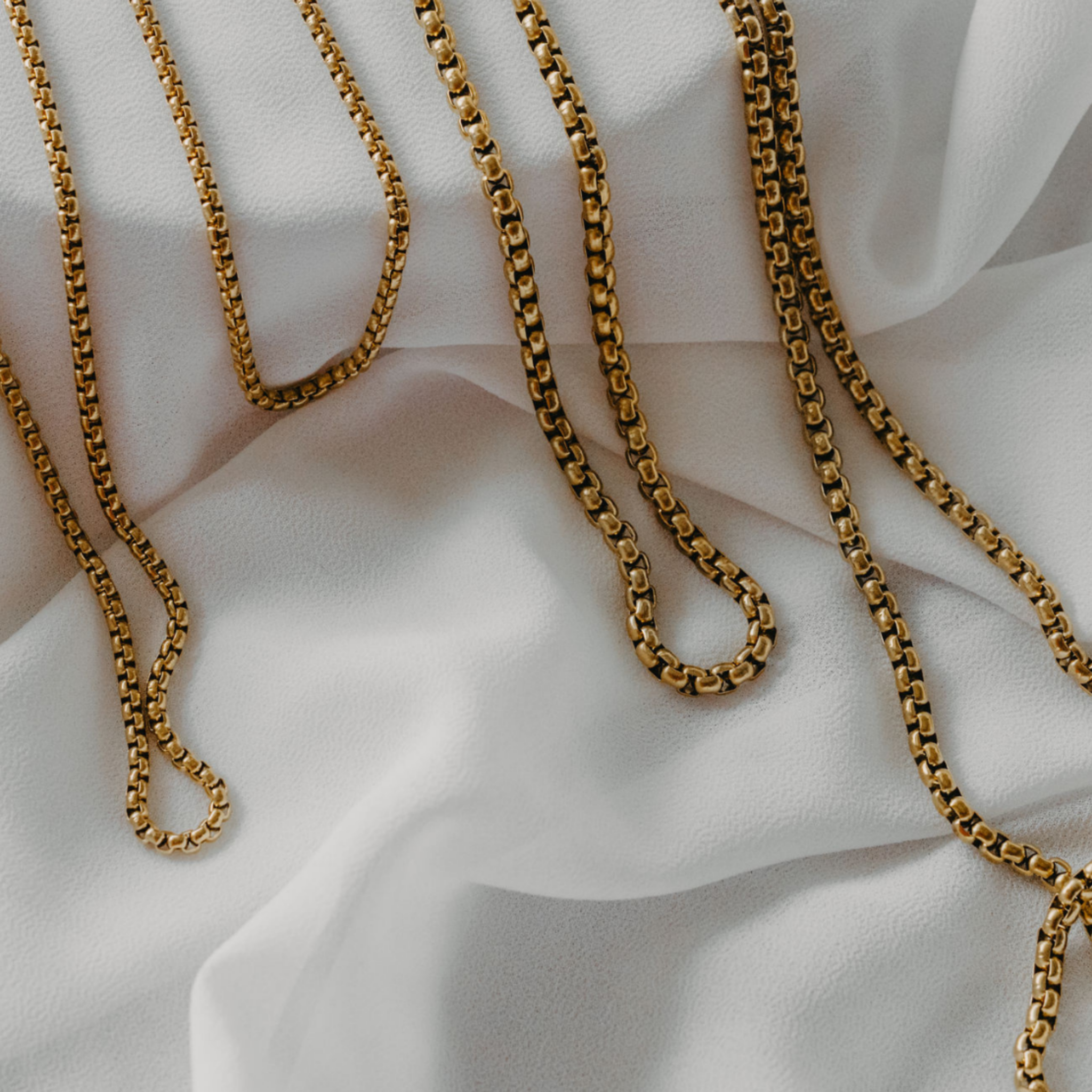 Reefline rounded box chain necklace in 18K gold PVD showing smooth link detail waterproof jewelry