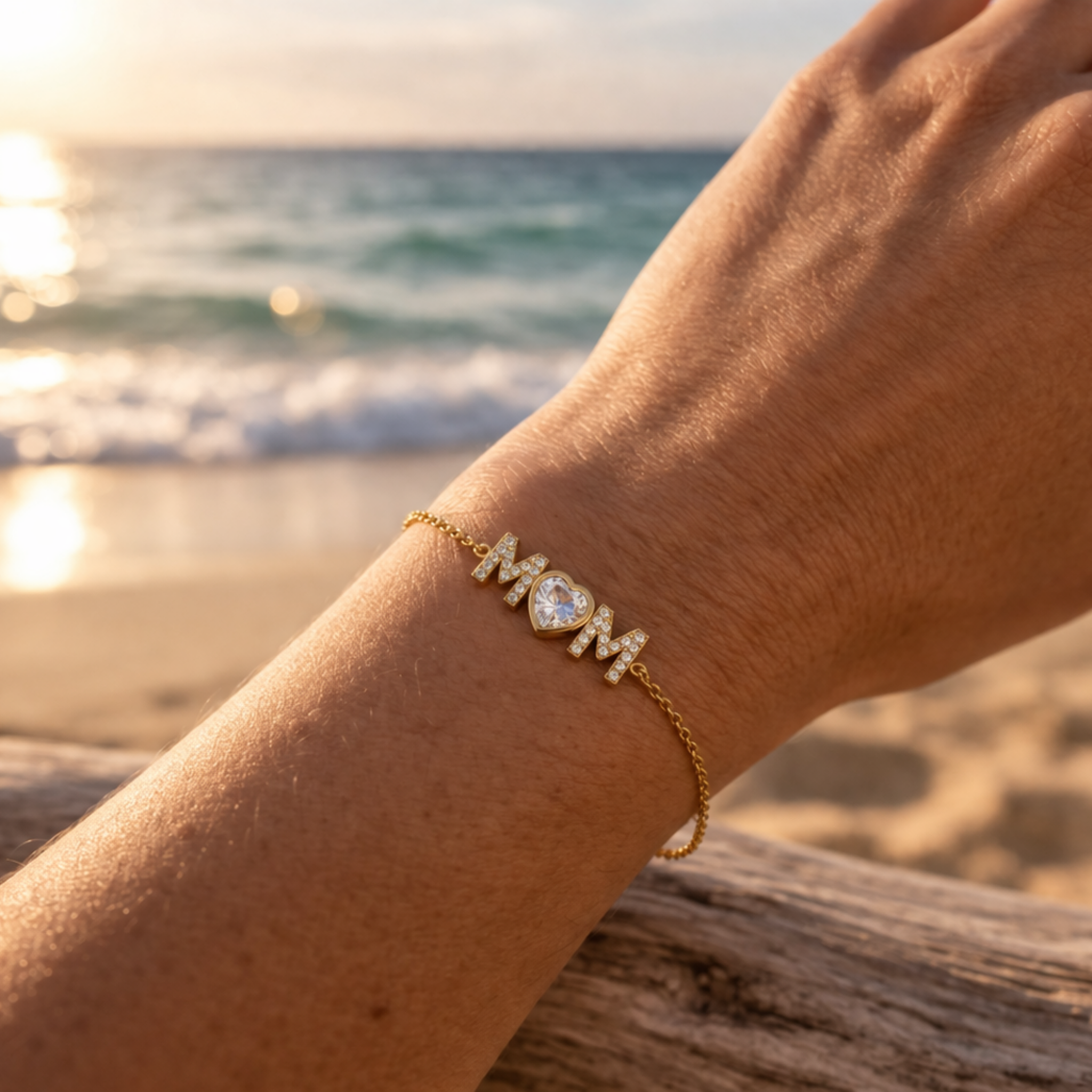 Mom Radiance bracelet worn at the beach with ocean background, waterproof 18K gold PVD bracelet designed for water, travel, and everyday life